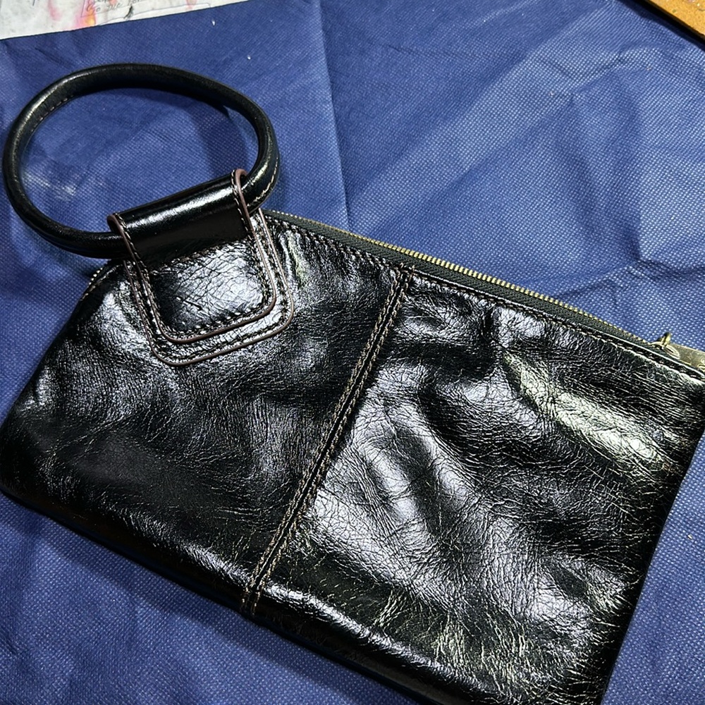 Hobo clutch bag in perfect condition. No call outs. Black beautiful leather.
